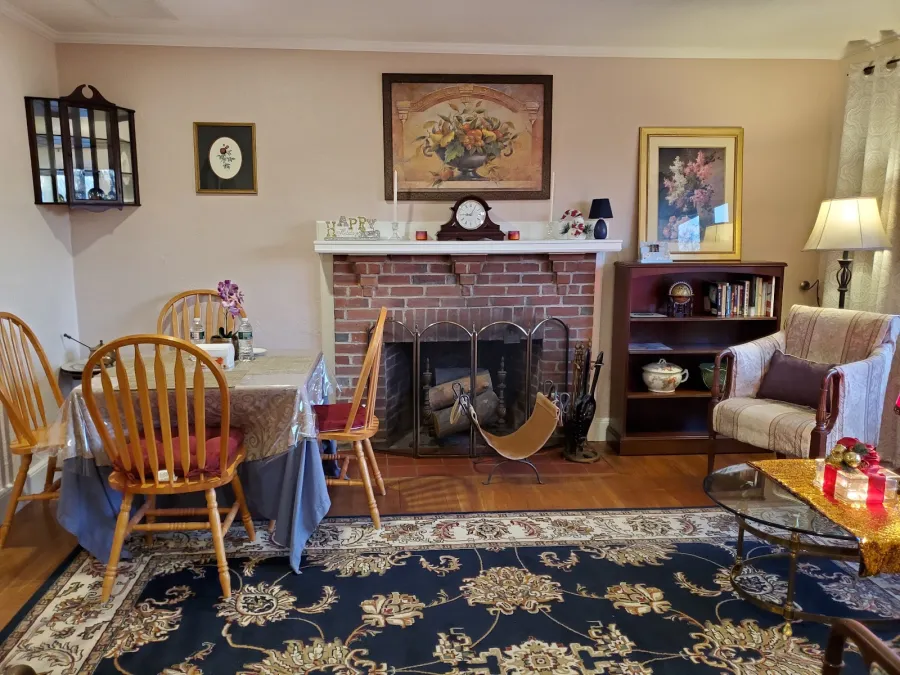 Sitting area with fireplace and upholstered chairs